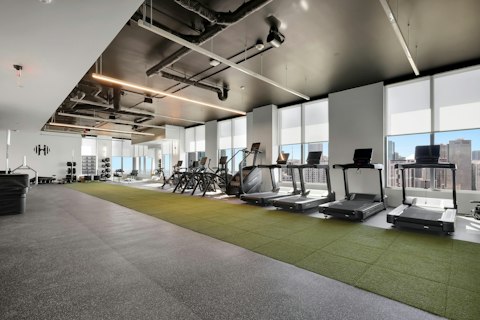 Train on treadmills with panoramic city views stretching to the horizon