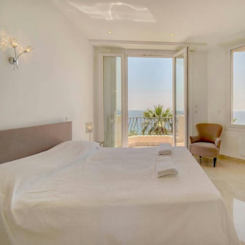 Wake up in the main bedroom to coastal panoramas