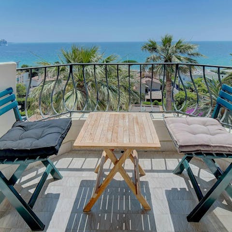 Drink in the sea views on the private balcony