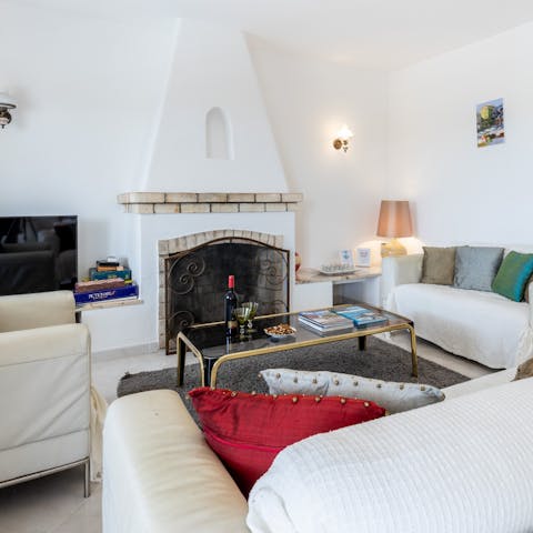 Spend cool evenings indoors gathered around the fireplace