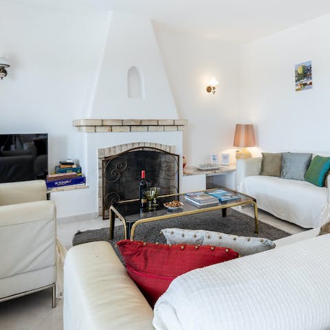 Spend cool evenings indoors gathered around the fireplace