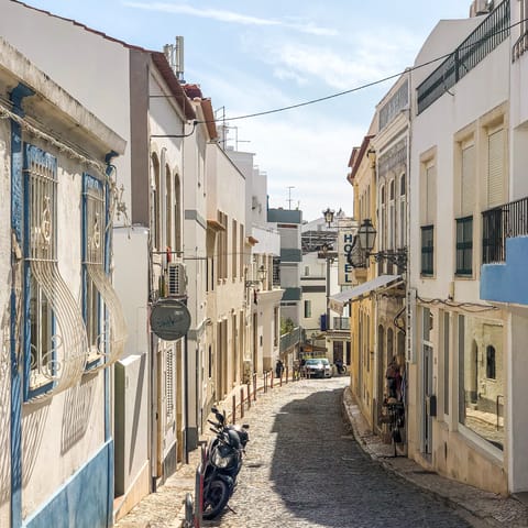 Wander the sunny streets of Lagos, just a ten-minute drive away