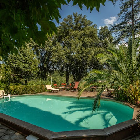 Escape to the private pool tucked within lush gardens