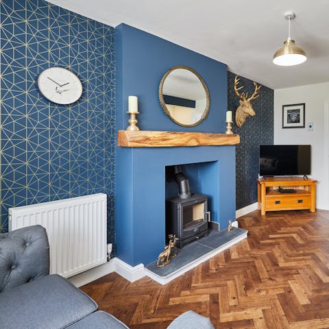 Relax with a glass of wine by the log burner