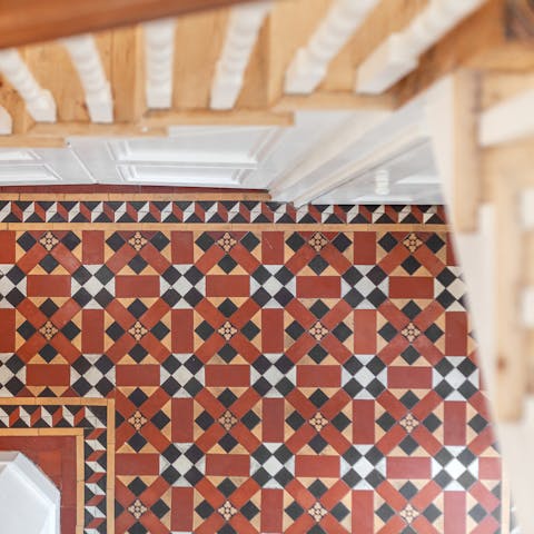 Fall in love with the Victorian details, like the tile flooring in the entranceway