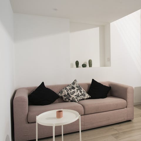 Relax on the sofa after a busy day exploring the city