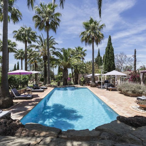 Immerse yourself in the cooling depths of the pristine outdoor pool & enjoy an instant refresh from the sun