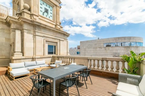 Dine above Barcelona on a sun-warmed terrace