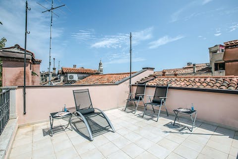 Laze around in the sunshine on the rooftop terrace