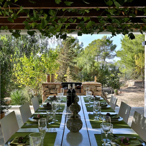 Enjoy lunch under the pergola's vines