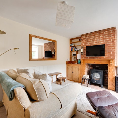 Warm up by the wood burner for a cosy evening in