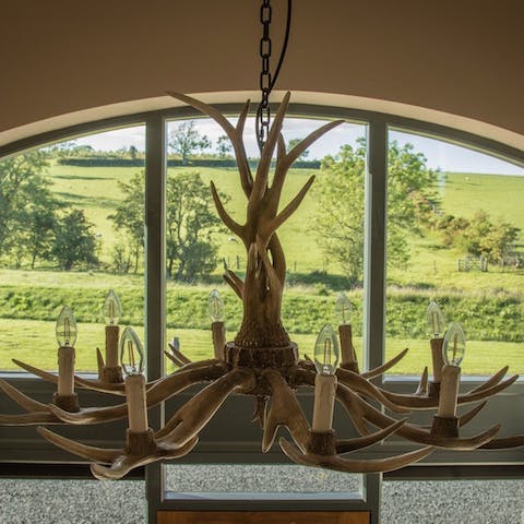 Gaze up at the deer antler chandelier – it's a unique focal point of the home