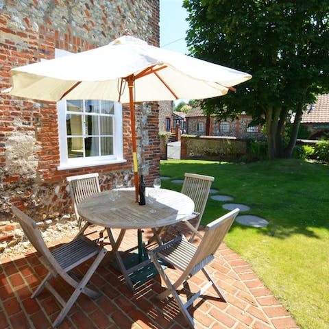 Enjoy afternoon tea and cake in the luscious garden