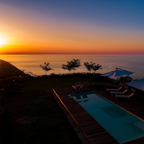 Watch the sunset from the private pool