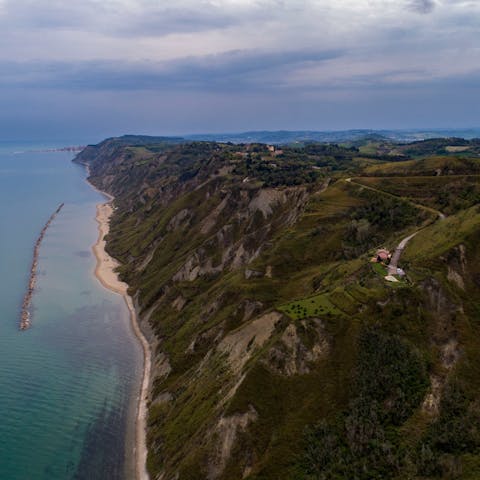 Explore the dramatic surrounding scenery of Pesaro