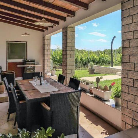 Tuck into an alfresco meal, overlooking the garden