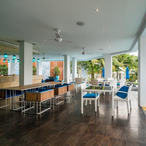 Sample the local Thai cuisine at the on-site restaurant