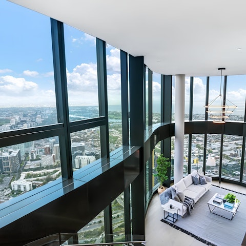 Admire panoramic views of Melbourne through floor-to-ceiling windows