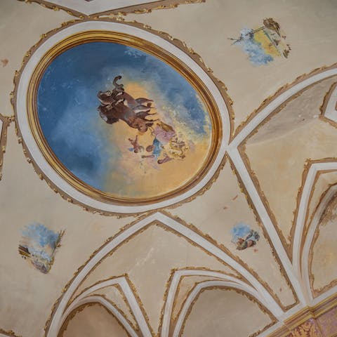 Stay in a 16th-century building, boasting its own chapel with a painted ceiling