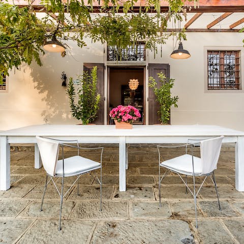 Sip your morning coffee under the vine-wrapped trellis