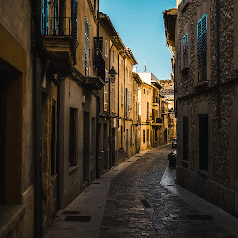 Explore the shops, churches and markets of pretty Pollença