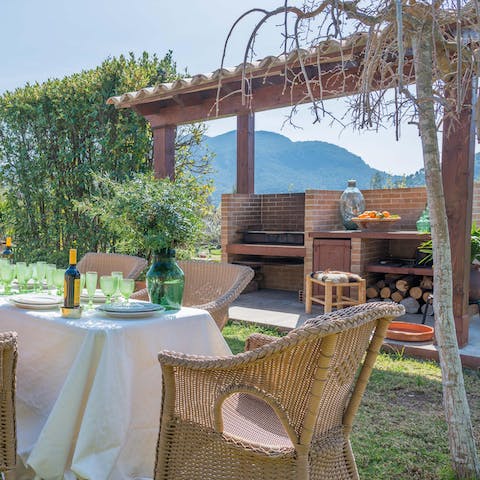 Spend balmy afternoons eating wood-fired pizza and sipping local wine