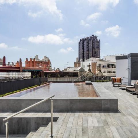 Head up to the communal roof terrace for a dip in the pool
