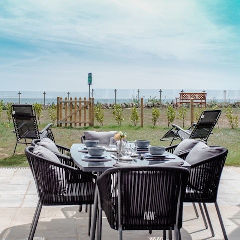 Dine on the private patio with a view of the Solent beyond
