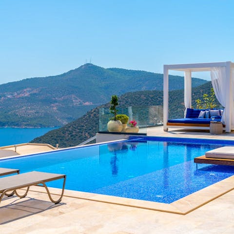 Drink in the scenery from the private infinity pool