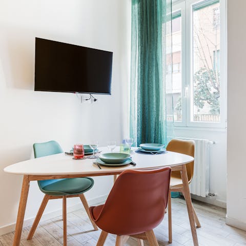 Enjoy a breakfast of coffee and croissants at the dining table
