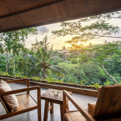 Enjoy an aperitif alongside jungle views