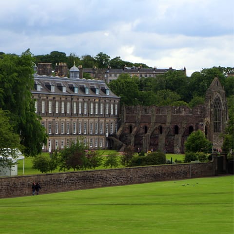 Visit the Palace of Holyroodhouse, a five-minute stroll away