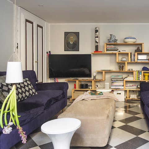Chill out on the purple velvet sofas in the trendy living space