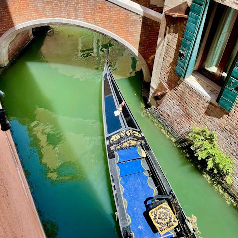 Watch gondolas pass by from the window