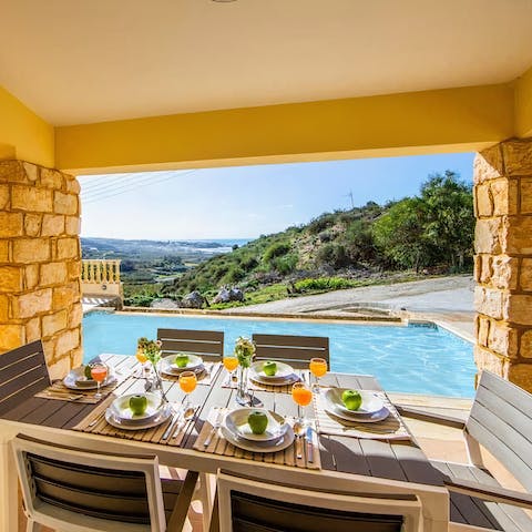 Share some fried halloumi and pitta bread around the outdoor dining table