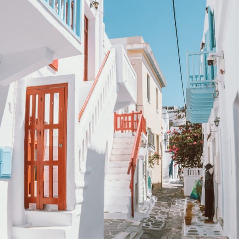 Take a leisurely stroll through the streets of Mykonos Town, just a five-minute walk from home