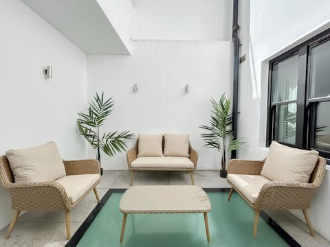 Sip wine with loved ones in the cosy courtyard