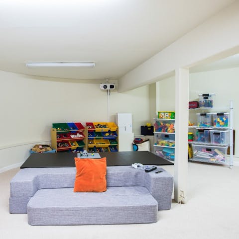 Let the kids run wild in the playroom by day and cinema by night