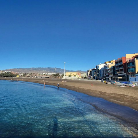 Take a stroll along Melenara’s black volcanic sands, just minutes away