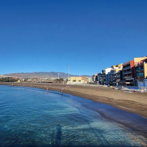 Take a stroll along Melenara’s black volcanic sands, just minutes away