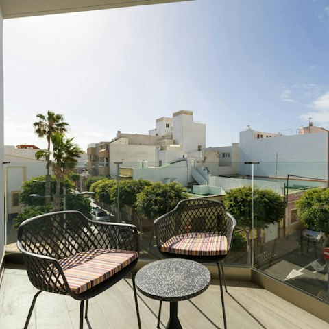 Unwind on the private balcony with the view of the town sea