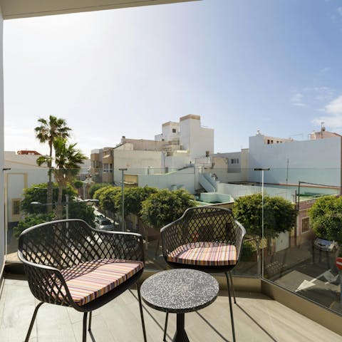 Unwind on the private balcony with the view of the town sea