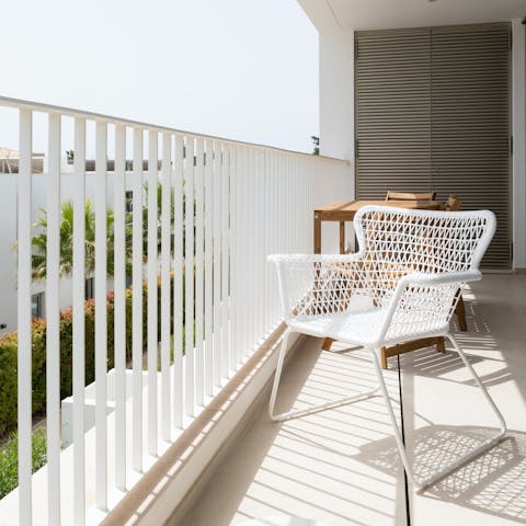 Sip an alfresco glass of Macieira on the sunny private balcony