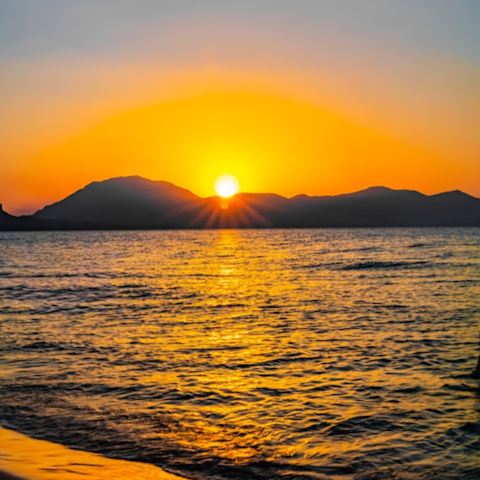 Make sunset strolls along the nearby beach the new routine