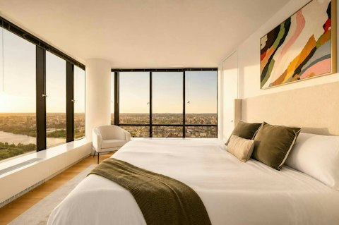 Wake to expansive river and city views