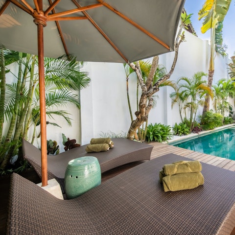 Stretch out and relax by your private pool
