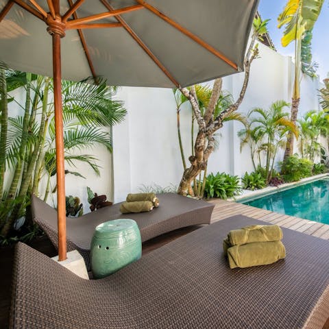Stretch out and relax by your private pool