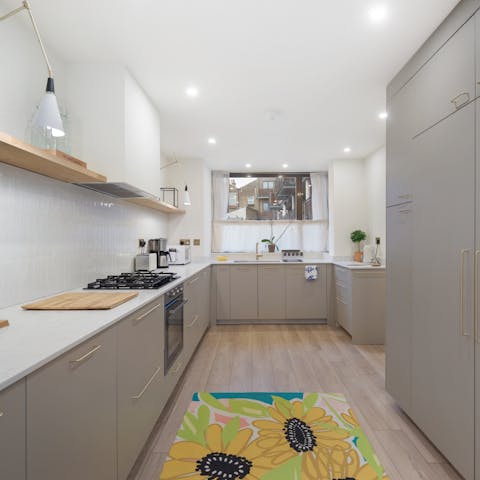Rustle up a homely meal in the sleek, modern kitchen
