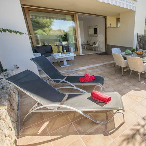 Soak up some rays on the patio's deck chairs