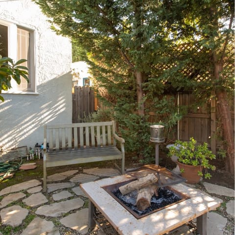 Sip wine around the firepit after the sun's gone down